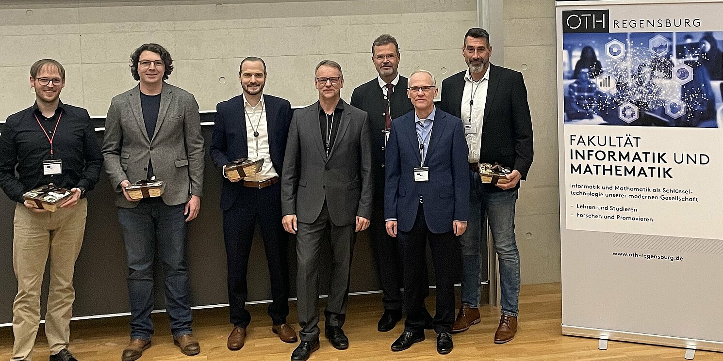 Gruppenbild mit den Referenten und Gastgebern des Symposiums.