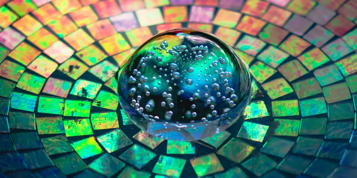 Colourful image of glass sphere and tiny mirrors