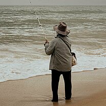 fisherman fishing on the beach