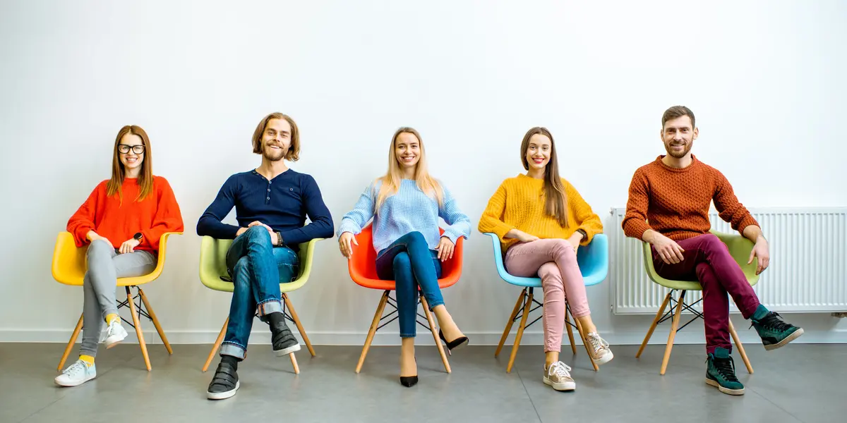 Young people sitting on chairs